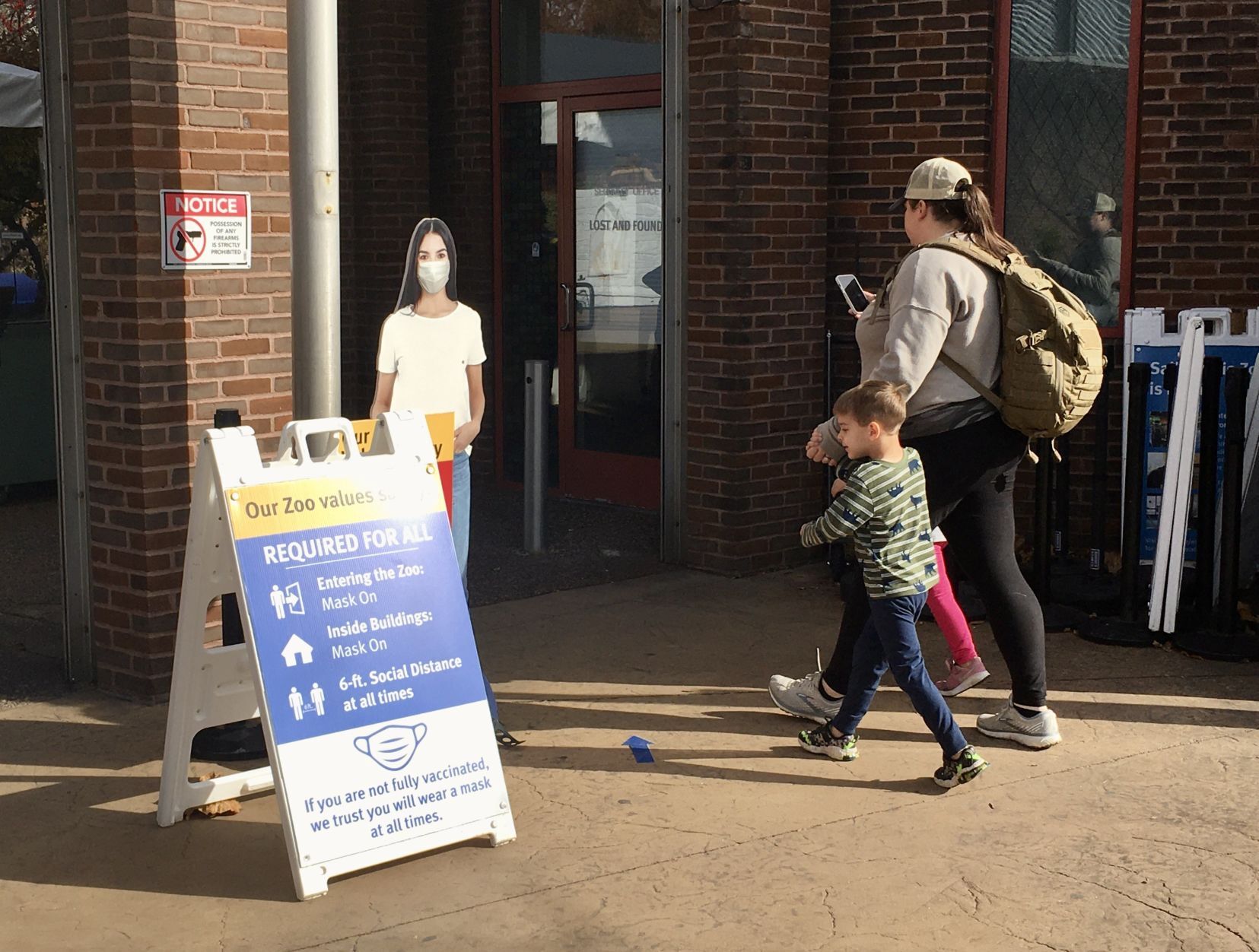 Visitors walk into the St. Louis Zoo